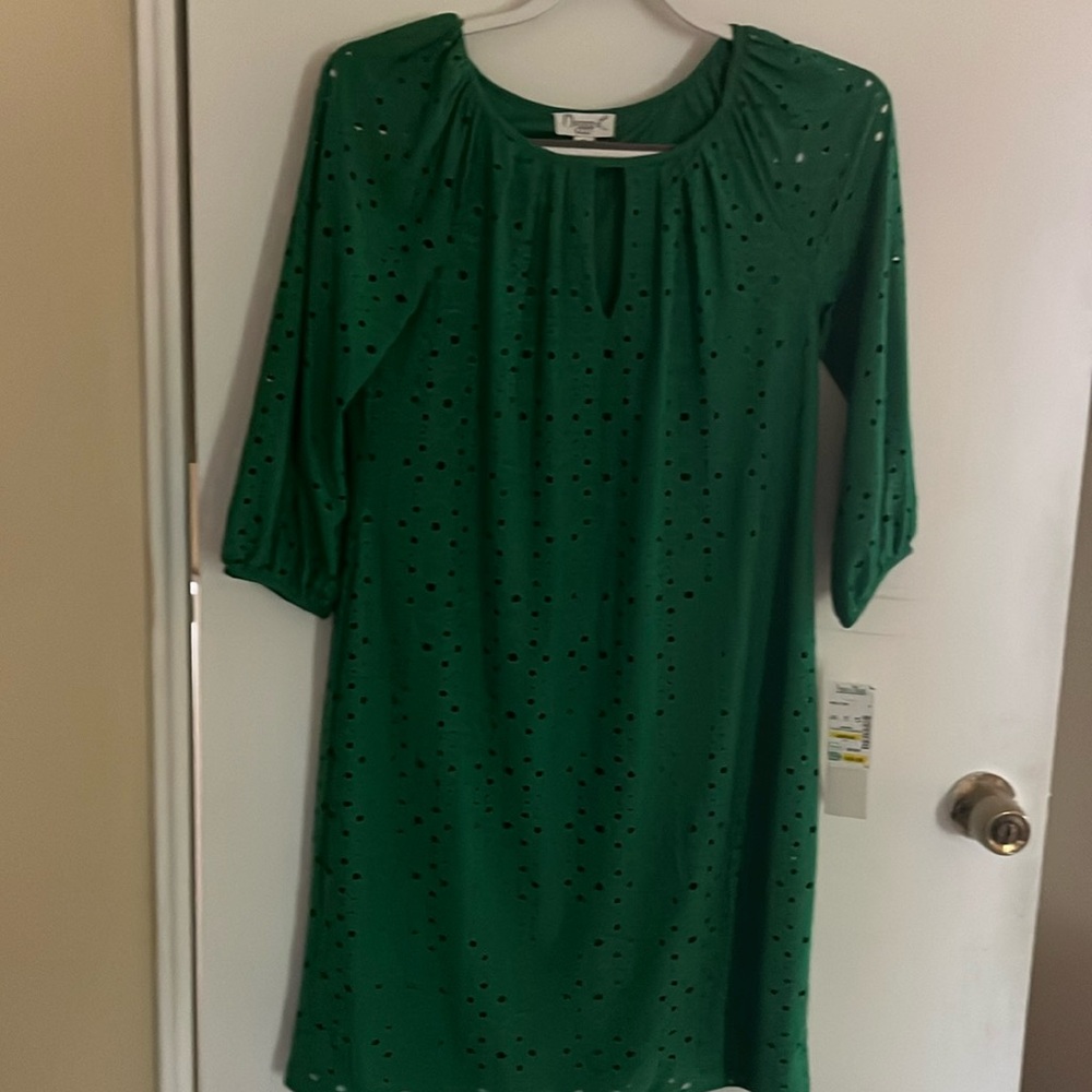 Light weight never worn new with tags. Dress is lined not sleeves. Light weight